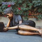 Customized garden decoration, life-size bronze statue of a girl lying on her