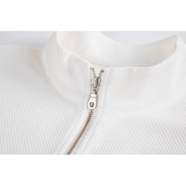 White textured piquÃ© half-zip mock neck top front view