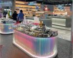 Creative Multi Level Acrylic Cosmetic Display Cabinet Oval Glowing Shop Display