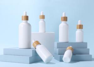 Wholesale Opal White Porcelain Ceramic 30ml 50ml Glass Dropper Bottle With Bamboo Cap from china suppliers