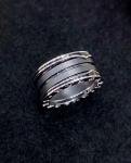 18K Gold Luxury Brand Jewelry Ring With Two 18 Kt White Gold Loops And A Black
