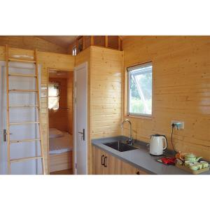 Wholesale Prefabricated Steel Frame Mini House With Laminate Flooring 110/220V/240v Electrical from china suppliers