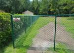 Chain wire fence protects and decorates garden and sports yard