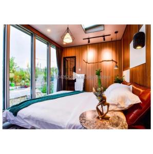 Wholesale Customized Color 40ft LOFT Family Style Mobile House with Prefabricated Steel Structure and Wooden Exterior Wall from china suppliers