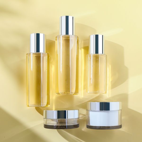 Refillable Cream Jar and Toner Bottle Set with Electroplated Silver Cap and Premium Transparency for Skincare Packaging