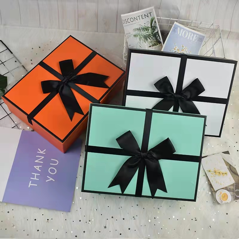 Spot Color Luxury Pink Rigid Cardboard Gift Box Handbags Cosmetic Gift Packaging Box with Ribbon