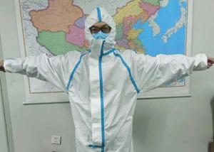 China Disposable Scrubs Medical Clothing Isolation Gown With Hat Shoe Covers on sale